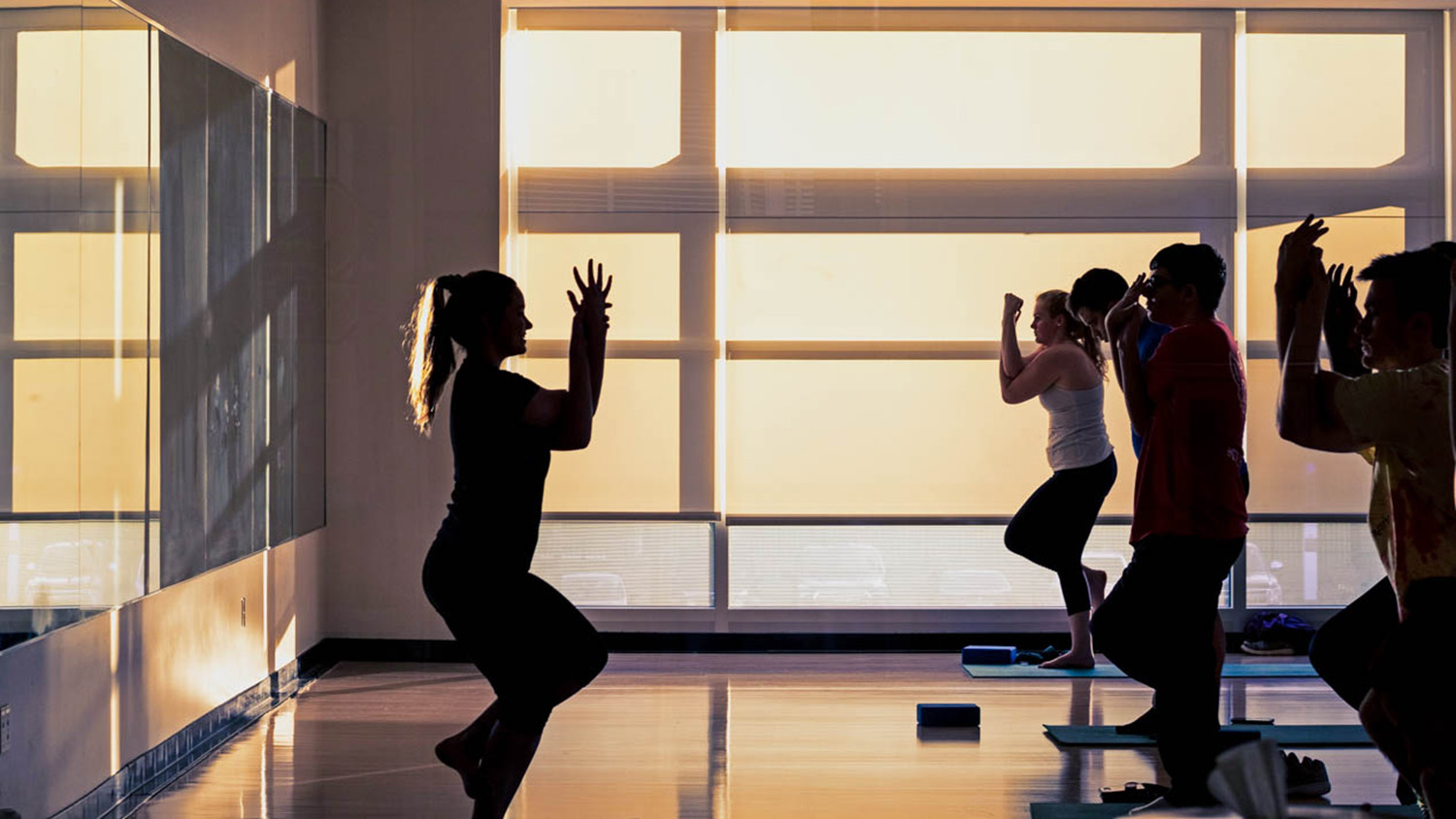 Students participate in a yoga class.
