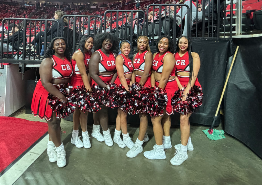 Danielle Moody and the Code Red cheer club at an NC State men's basketball game at Lenovo Center.