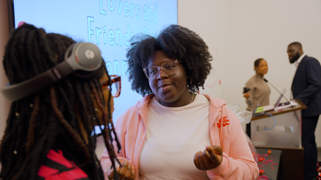 Danielle Moody speaks to a fellow student in the African American Cultural Center.