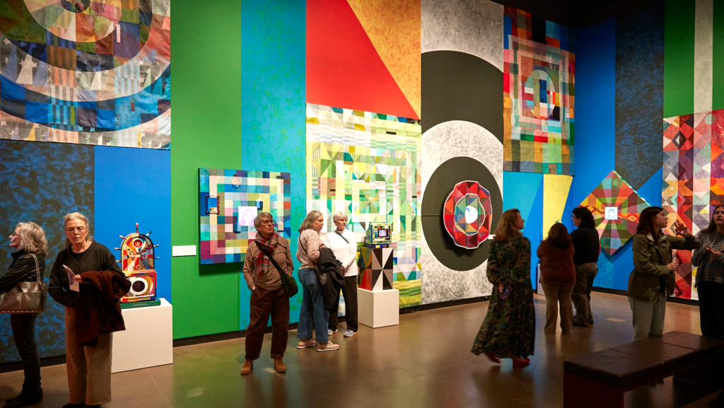 Museum patrons view Carl Joe Williams' Amazing Grace.