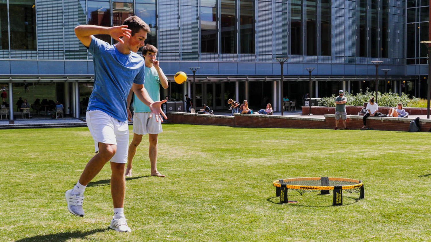 Students play a game of spike ball on Stafford Commons.