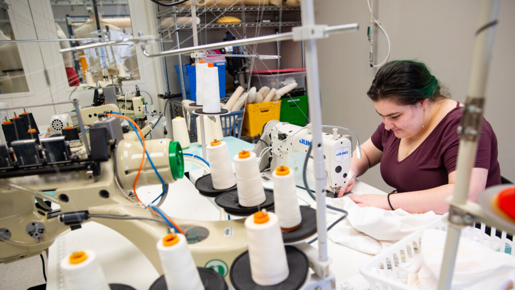 Bee Mangine works on costumes for the Panoramic Dance Project.