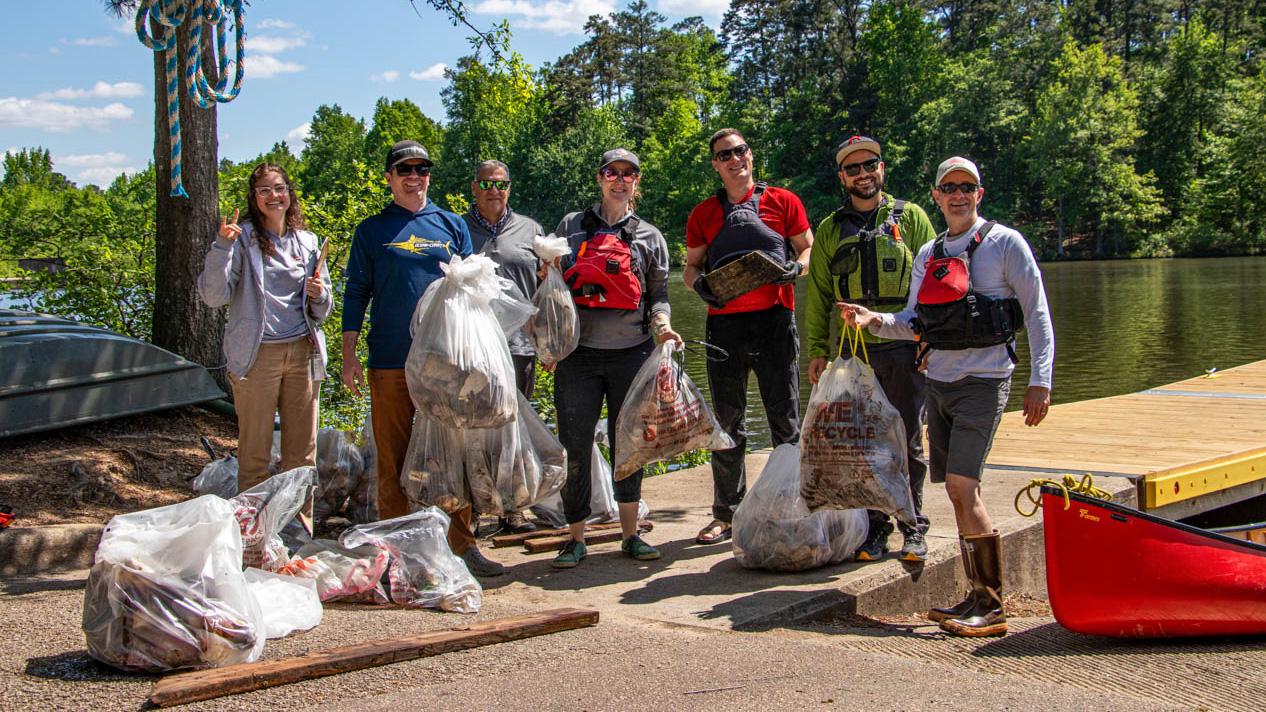 Students participate in a sustainability initiative at Lake Raleigh.