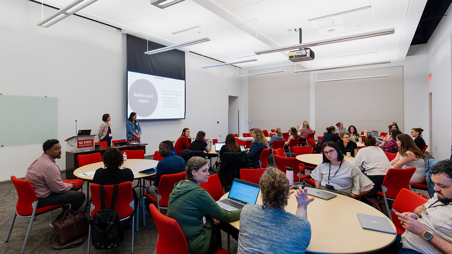 Faculty and staff gather to share student success best practices.