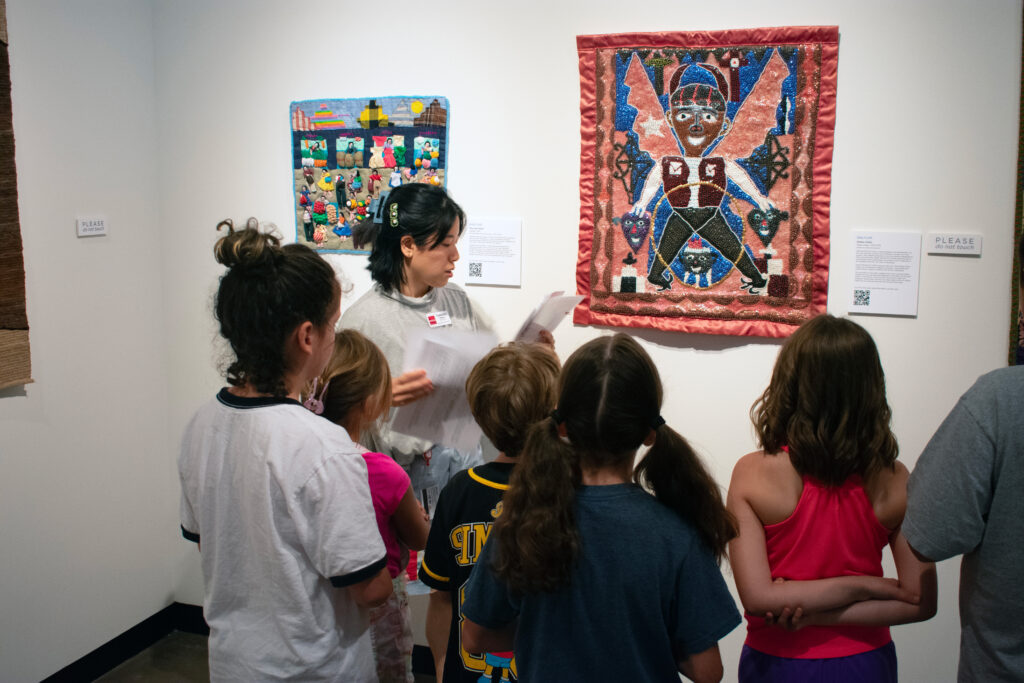 Gregg Museum Education Coordinator Tamara Velasco leads a group of children on a museum tour.
