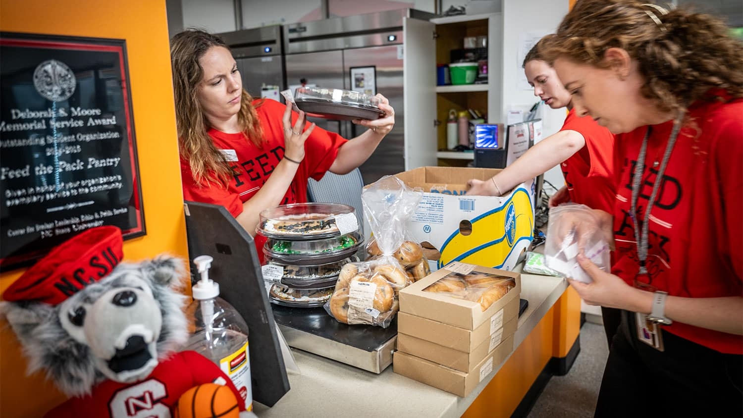 The Feed the Pack team inspect and organize donations of baked goods.